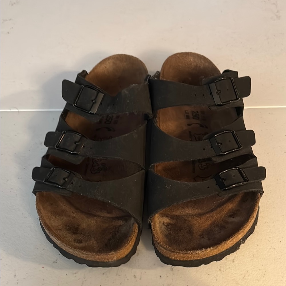 Birk’s black three strap sandals